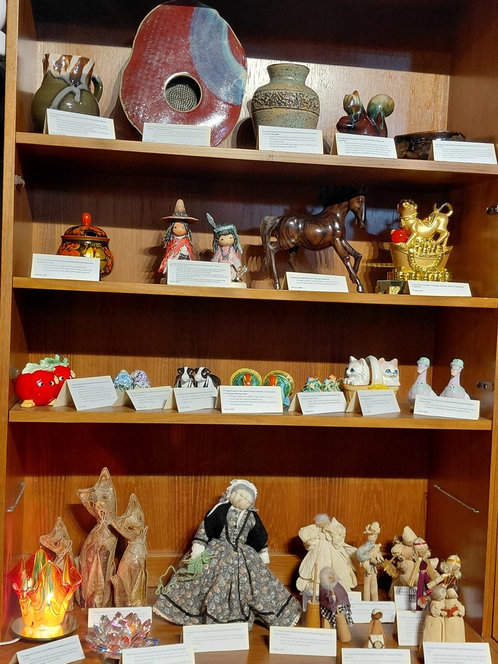 Shelves of vintage figurines and pottery