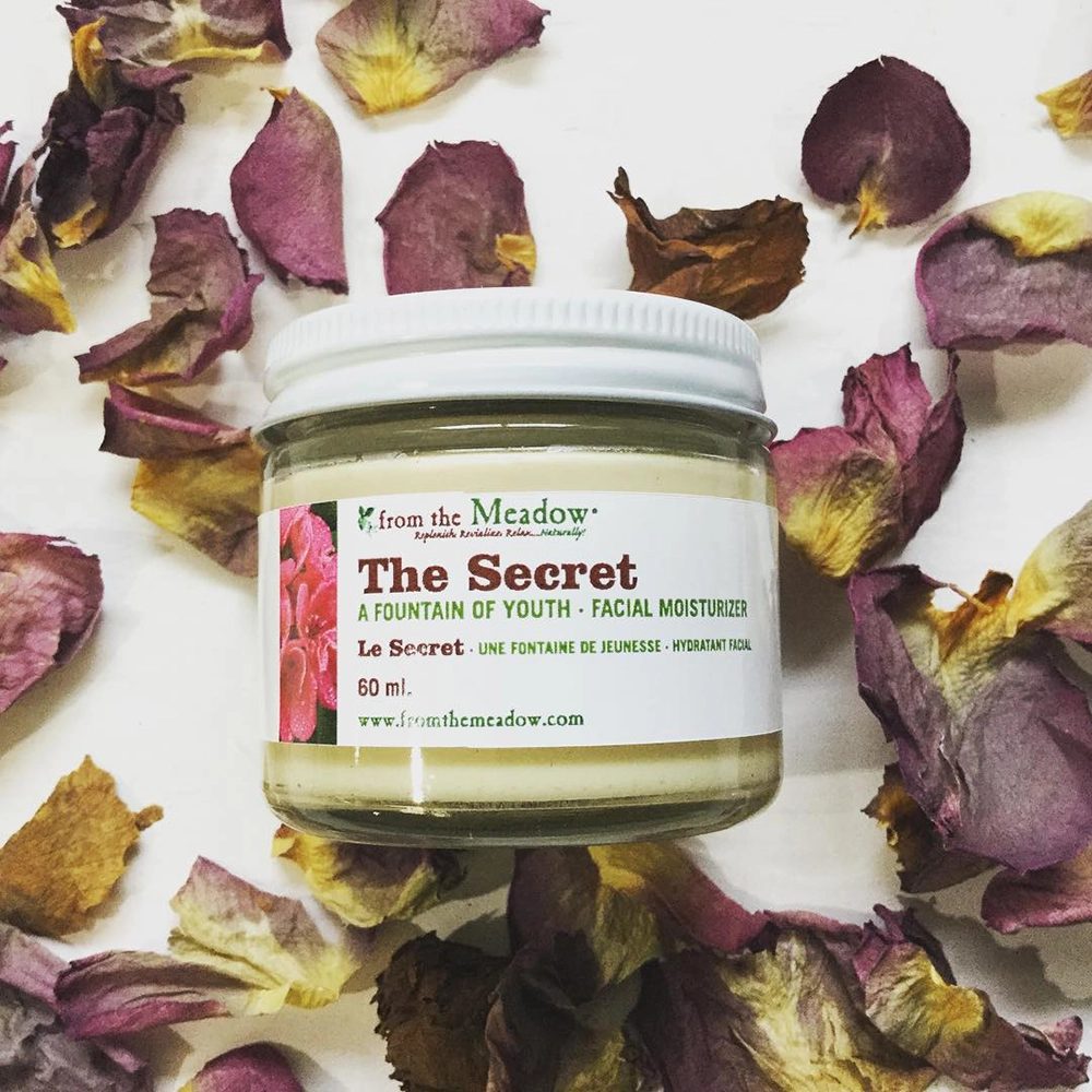 The Secret facial moisturizer among rose petals